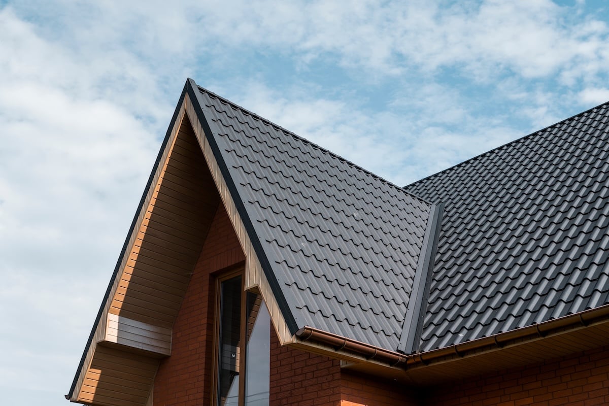Modern roof covered with tile effect PVC coated brown metal roof sheets