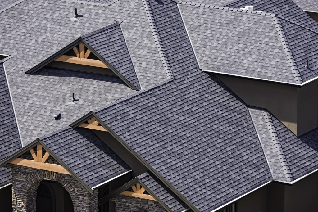 arial view of a home with dark shingles