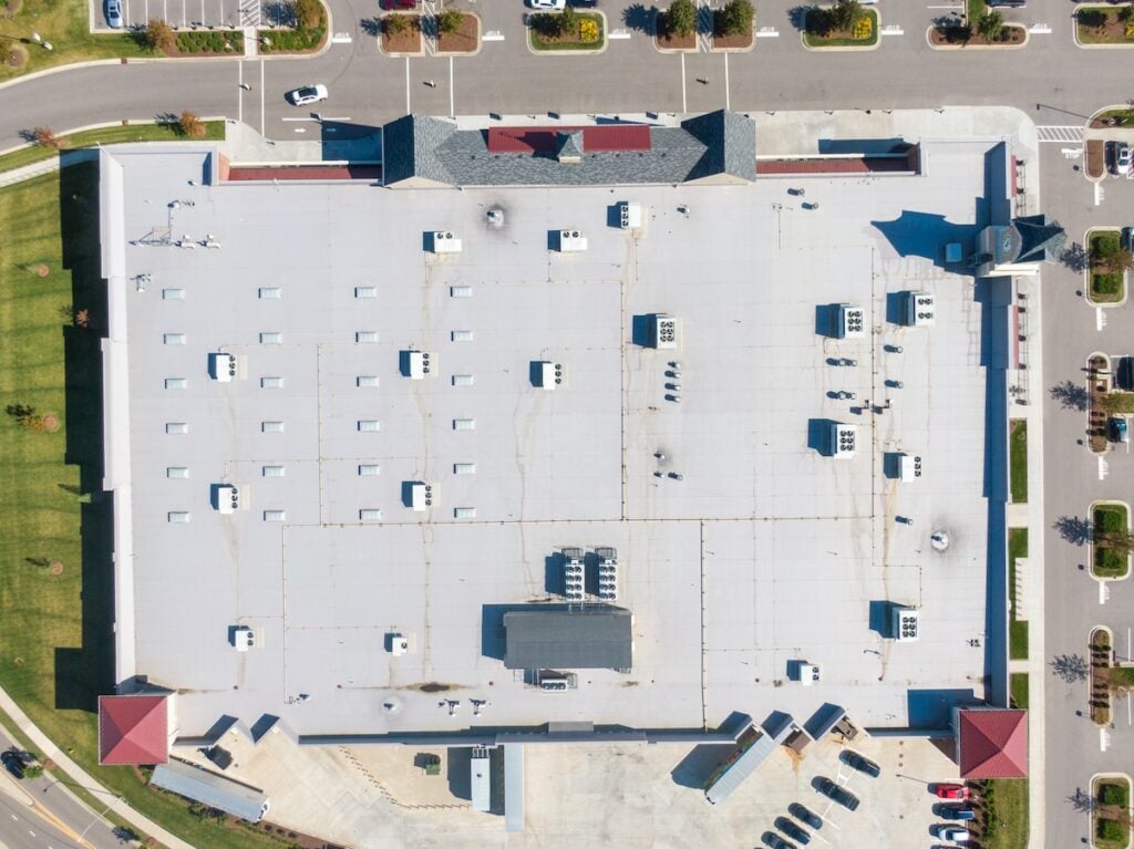 Drone Images of TPO Flat Commercial Roof With Metal Panels: New & Existing Construction