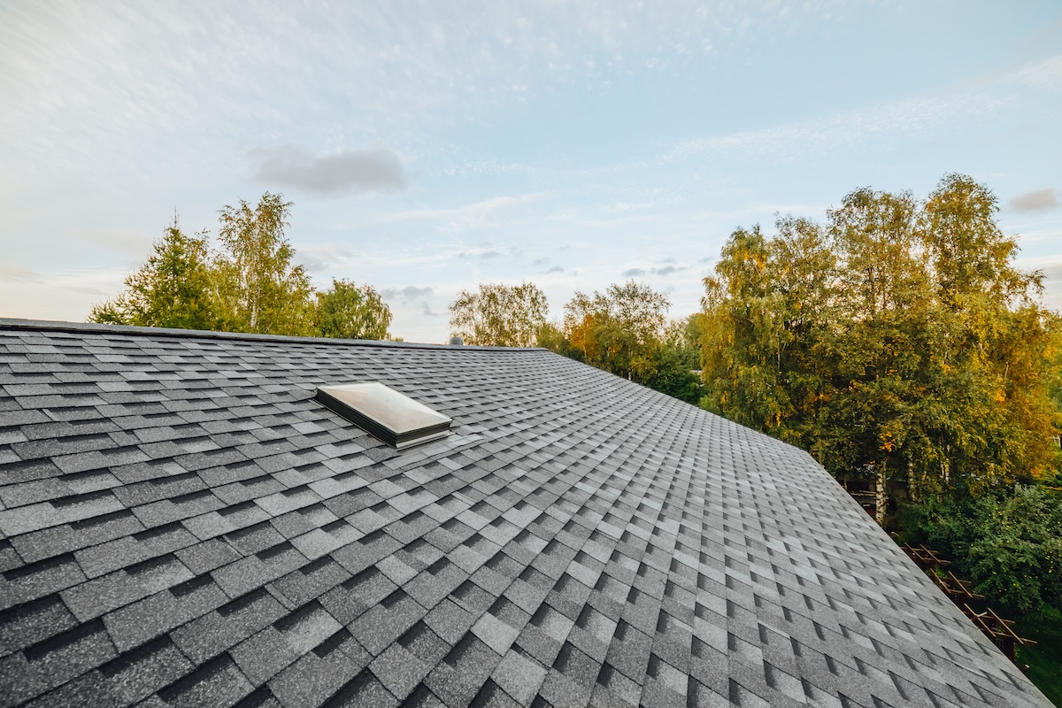 roof warranty new renovated roof covered with shingles flat polymeric roof-tiles