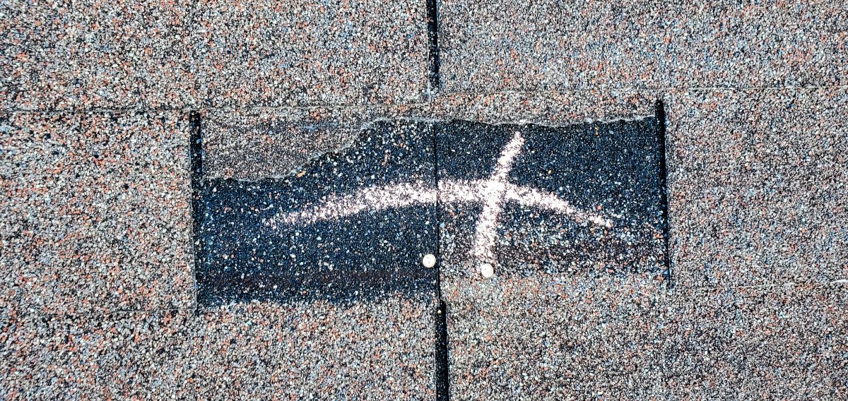 This Shingle Has Detached Due To Wind Damage