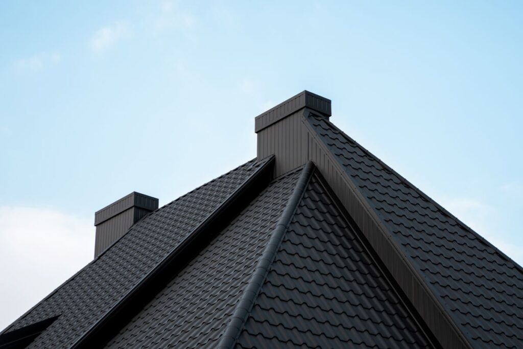 Modern black metal tile roof with vents