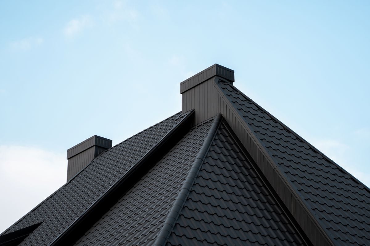 Modern black metal tile roof with vents
