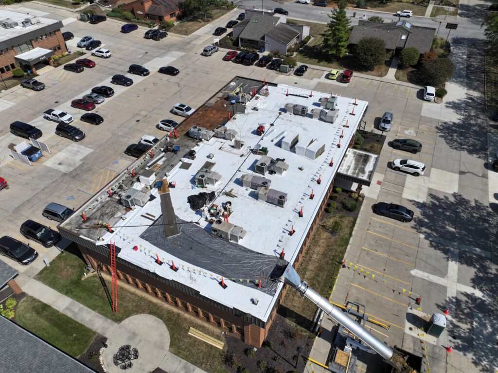 A commercial roof being inspected for leaks
