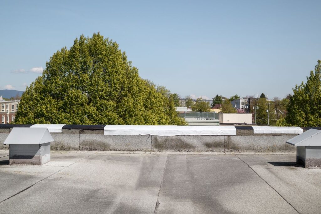 Self-adhered waterproof membrane on flat roof edge