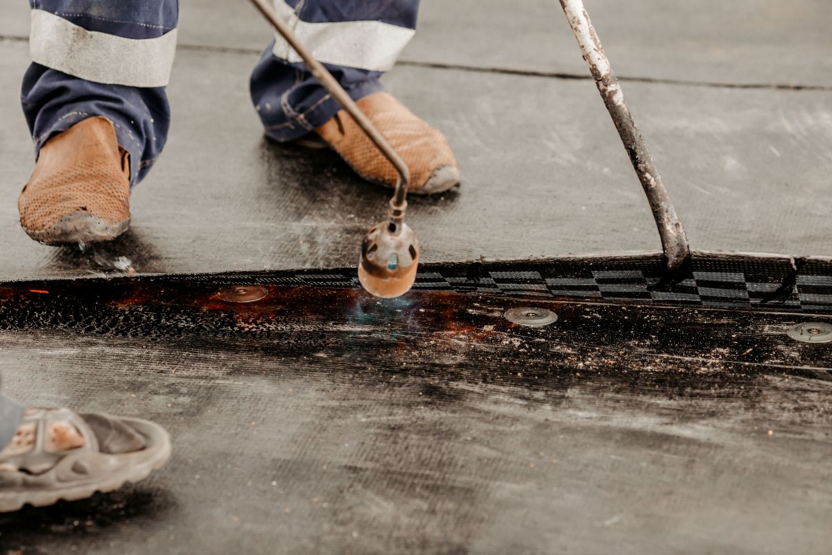 roof repair. a roofer repairs the roof.