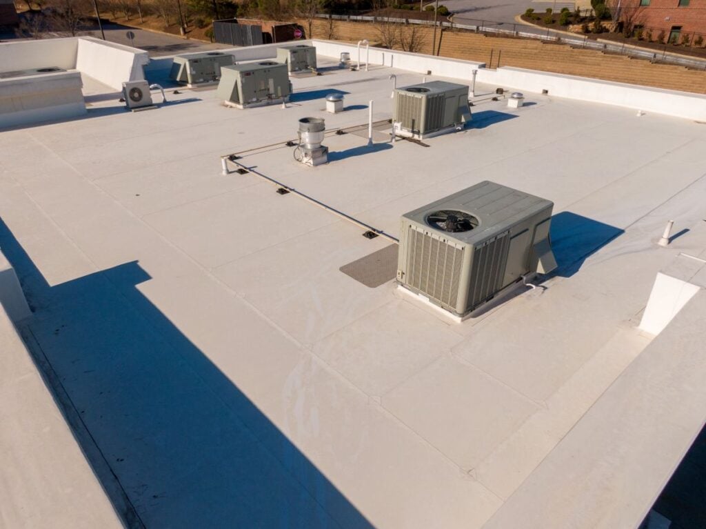High Resolution Sunny Aerial Drone Image of a New TPO Roof on a Commercial Building With Visible HVAC Equipmen, Roofing