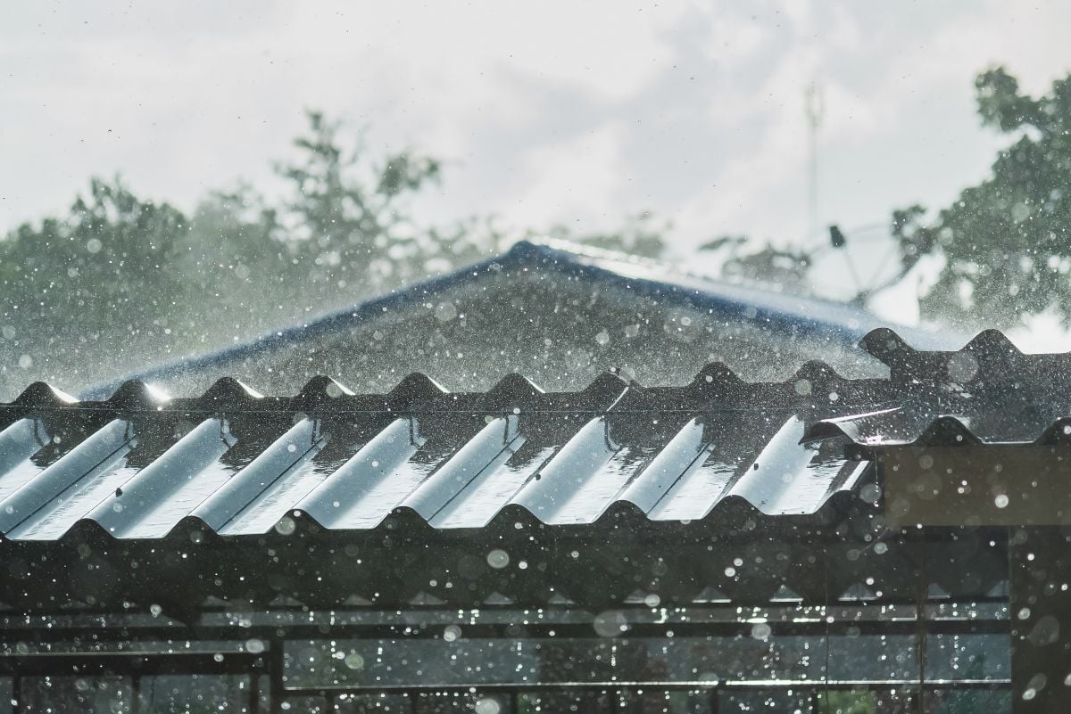 Storm rain on the metal roof of a house