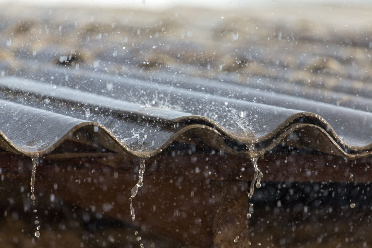 close-up of a metal roof with heavy rain