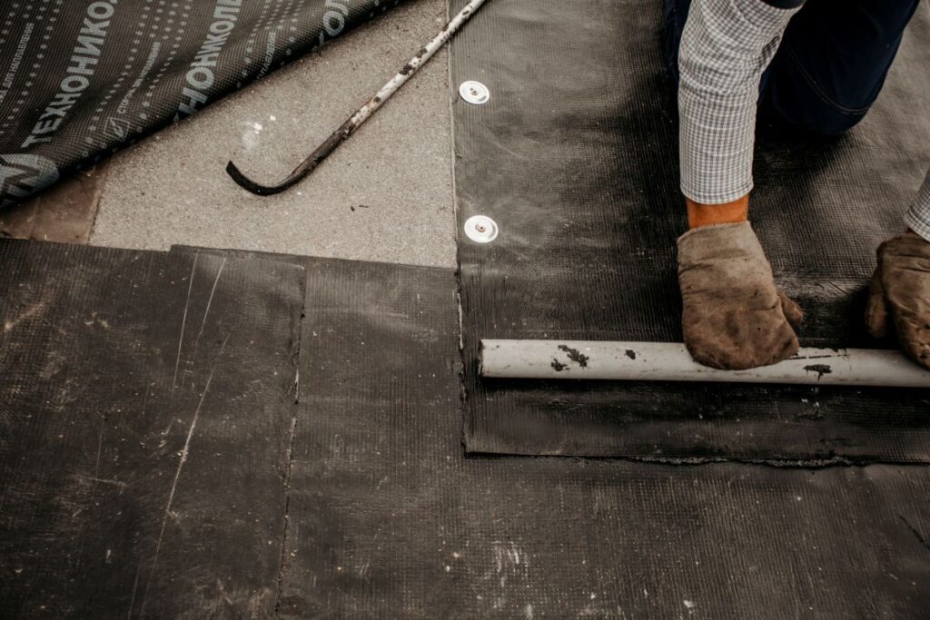 roof repair. a roofer repairs the roof. roofing tools